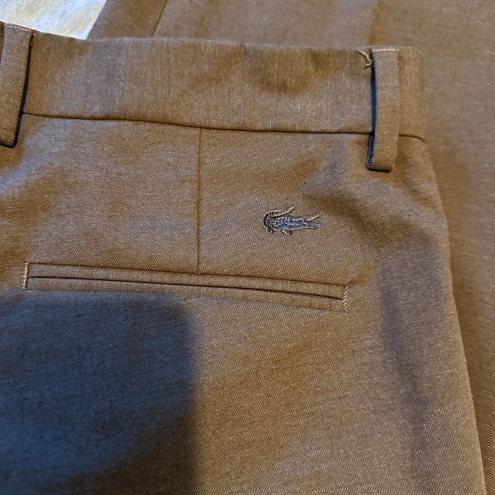 Lacoste beautiful Brown slacks to dress up or wear as chinos.